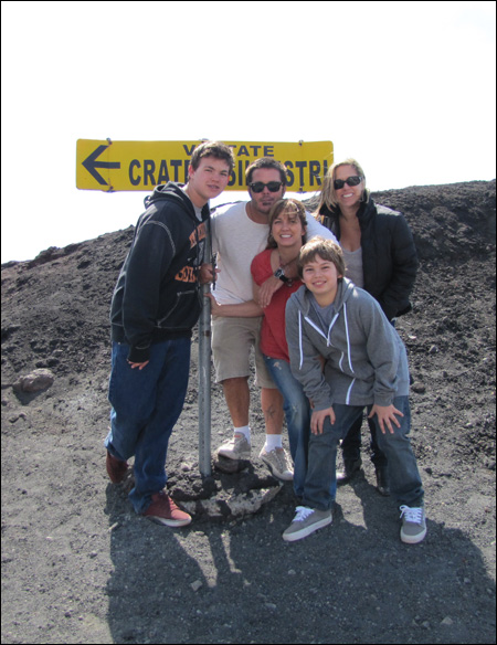Here's a group shot of us near the sign at the volcano's crater.